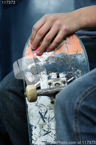 Image of Kid holding a skateboarder