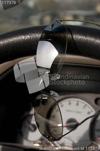 Image of Sunglasses on the steering wheel