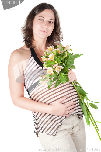 Image of Portrait of pretty pregnant woman with flowers