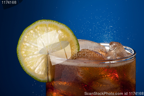 Image of Close-up glass of cola with lime