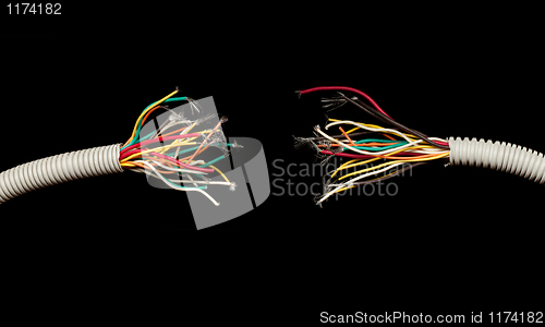 Image of torn apart wires isolated on black