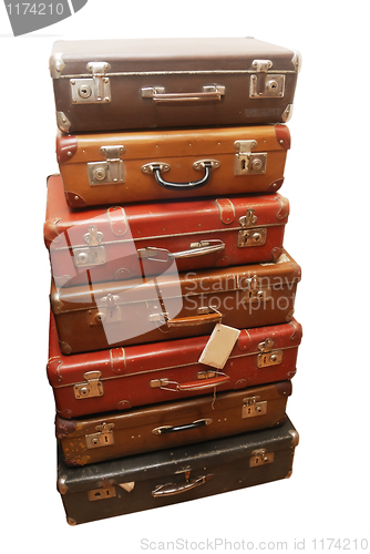 Image of Pile of battered old suitcases