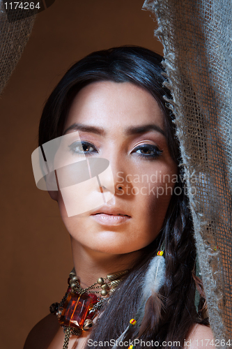 Image of American Indian woman looking from the tent