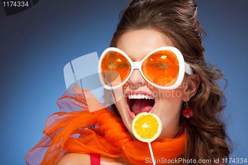 Image of Woman with citrus lollipop