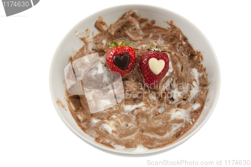Image of A plate of messy chocolate mousse with strawberries