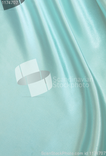 Image of Smooth elegant blue silk as background 