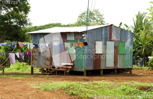 Image of ramshackle zinc  house laundry hanging Corn Island Nicaragua