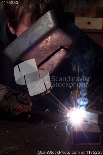 Image of A factory welder at work