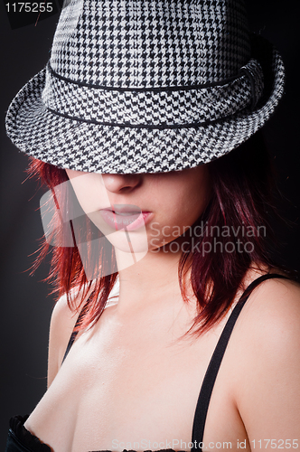 Image of Vintage photo of a beautiful girl in sylish hat