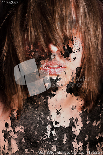 Image of Dark art portrait of a girl with cracks and old paint