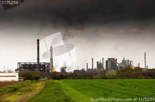 Image of Power plant emitting dark black smoke entoxicating the world