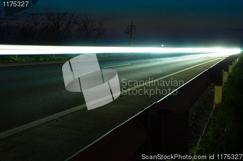 Image of White light on road at night