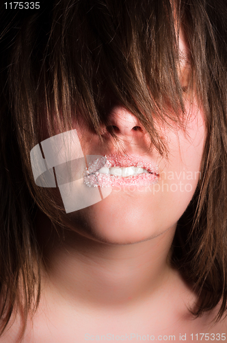 Image of Girl biting her lips with sugar on it