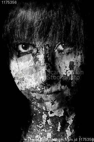 Image of Dark art portrait of a girl with cracks and old paint in black a