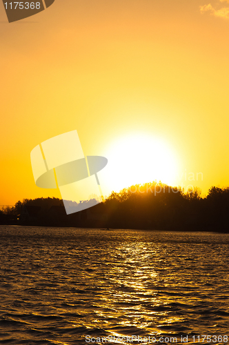 Image of Sunset on the horizon with water reflecting rays