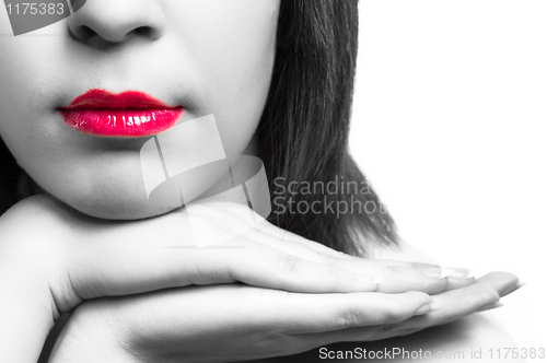Image of Lips of a girl with her hands in selective tones