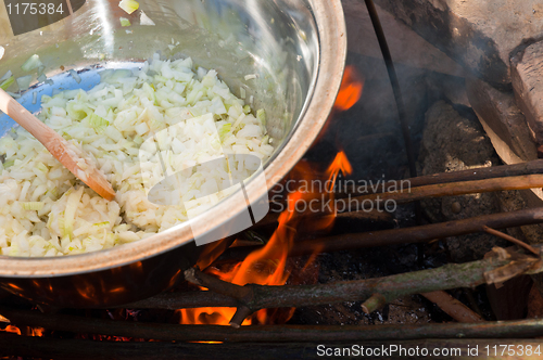 Image of Onions boiling in campfire