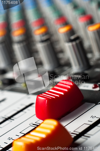 Image of Big red slider on a sound mixer