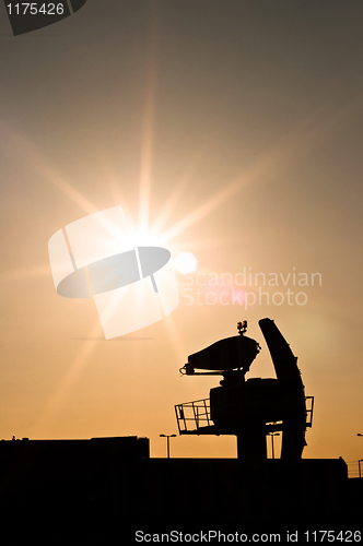 Image of Silhouette of an old radar against sunset