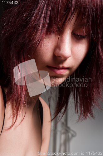 Image of Beautiful young girl looking depressed