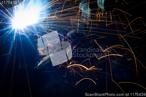 Image of Hot sparks at grinding steel material