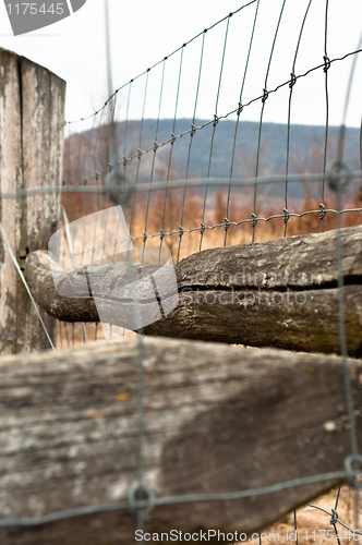 Image of barbed wire on wooden fence