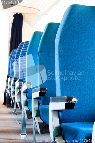 Image of Blue seats of an Airplane with blurry background