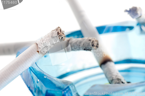 Image of Closeup image of ashtray and cigarettes, isolated on white backg