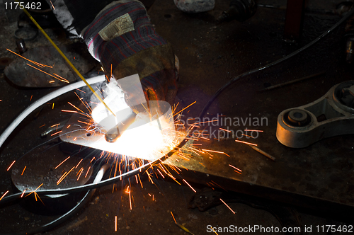 Image of Welding plates togather with sparks