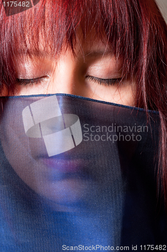 Image of Girl in scarf with closed eyes
