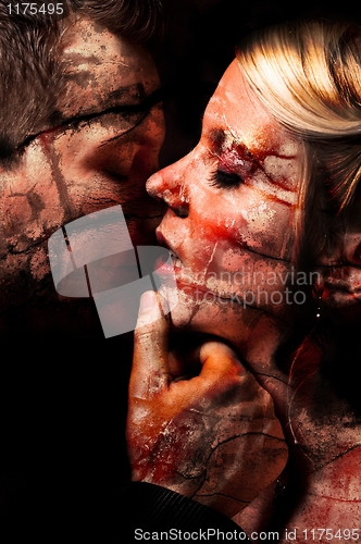 Image of dark art of a young couple kissing