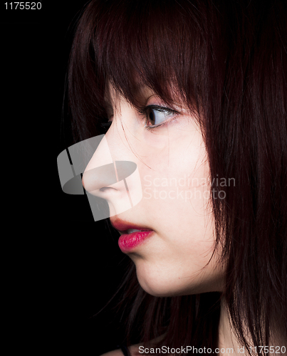 Image of Beautiful girl gazing into the darkness with lot of copy space