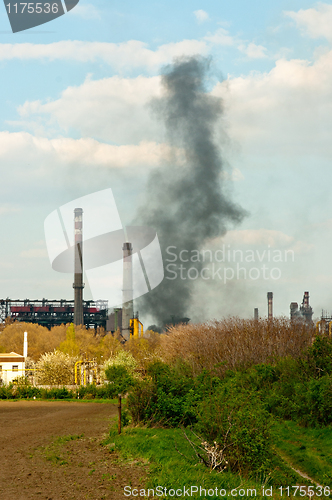 Image of black smoke rises from power plant