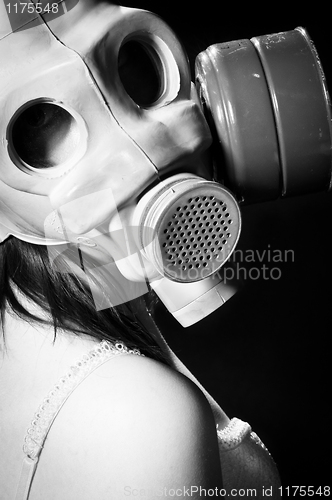 Image of Girl wearing gasmask and white lingerie in black and white