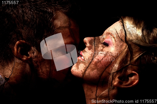 Image of Dark art seduction studio shot of a couple