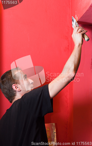 Image of Painter working on wall