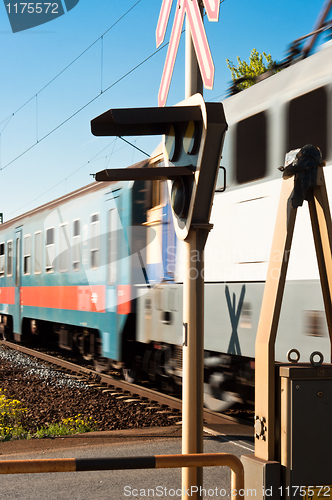 Image of A european train in motion with lamp