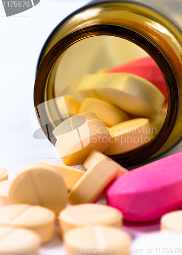 Image of A bottle of pills on white isolated background