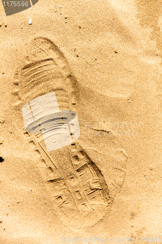 Image of Closeup of a footprint in the sand