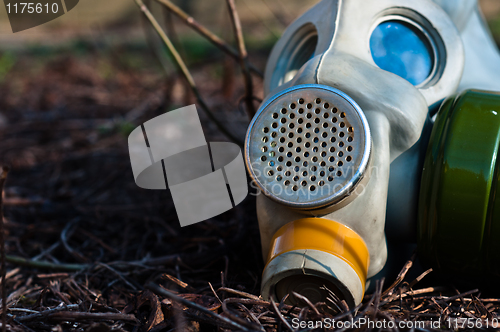 Image of Protective gasmask in the middle of a disaster