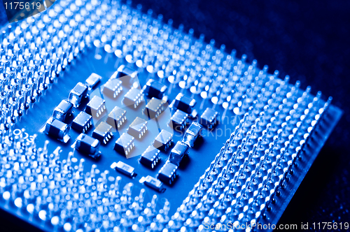 Image of silicone chip cpu showing mounting pins in blue