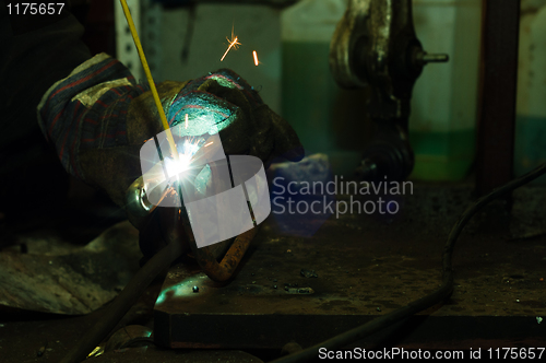 Image of Welding in industrial enviroment with white sparks