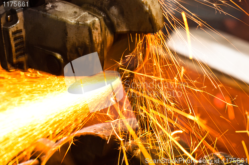 Image of Machine cutting metal with sparks