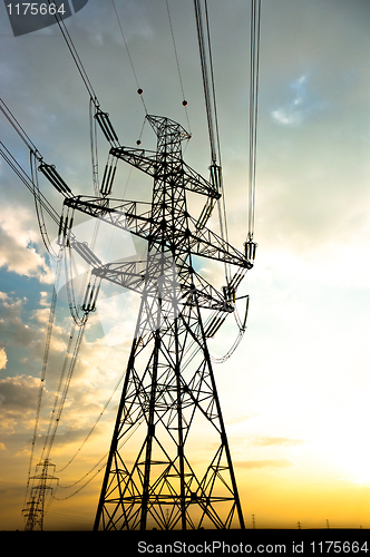 Image of Electric lines leading into sunset