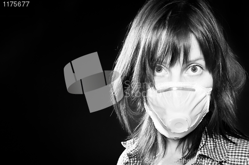 Image of girl wearing protective mask in black and white