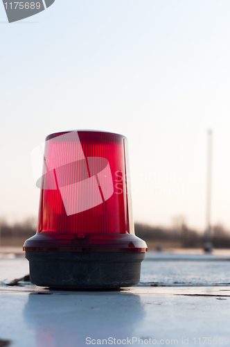 Image of A red siren on a top of a car