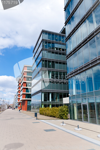 Image of City central with business and trade buildings and sidewalk