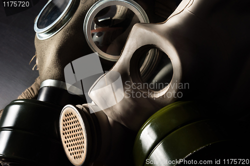 Image of Closeup of a gasmask with enlighted background