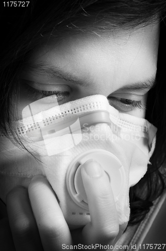 Image of Girl wearing protective mask in black and white