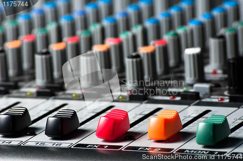 Image of Sliders and buttons of a Sound Mixer